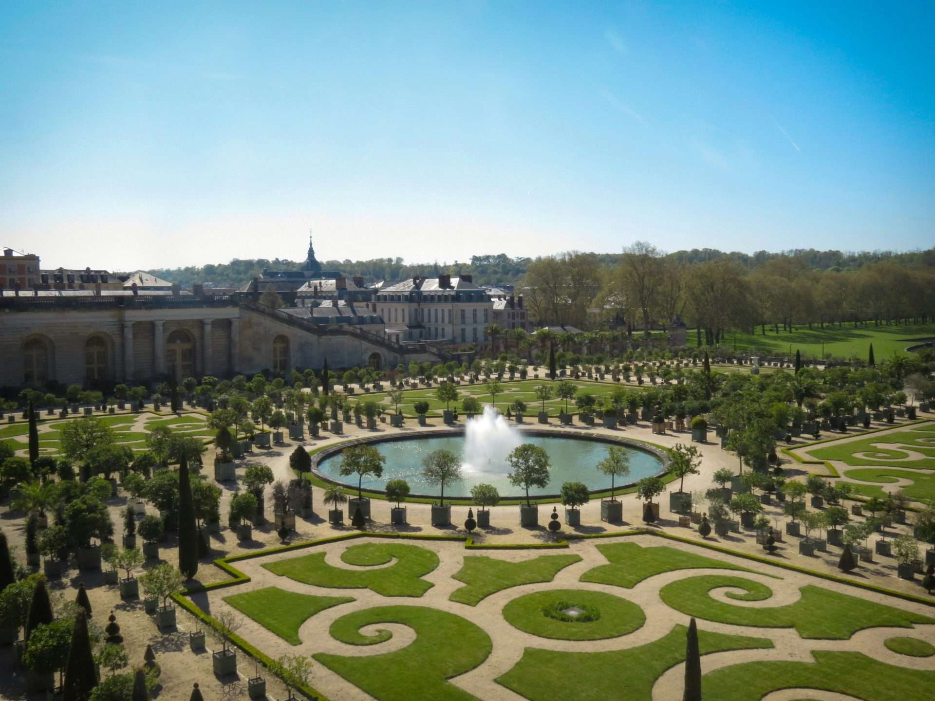 Beautiful garden with fountain and formal hedging.